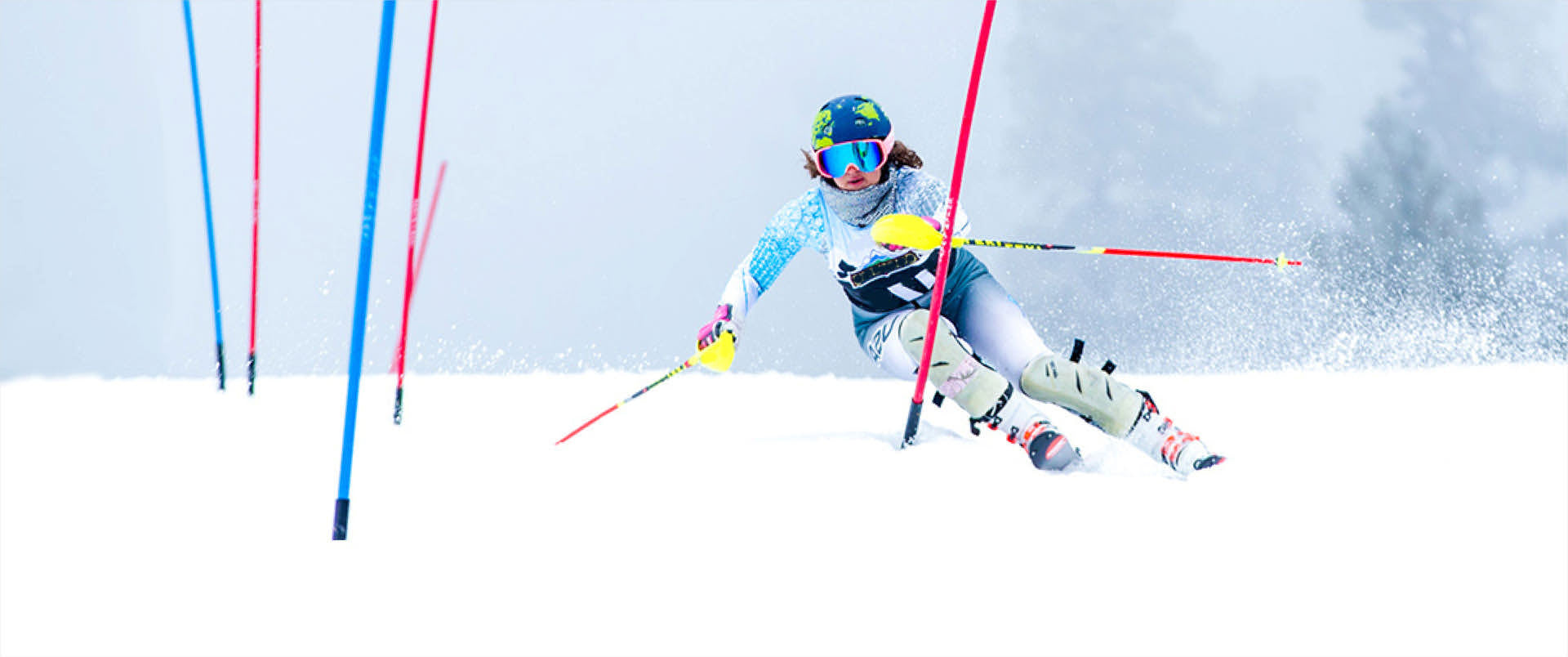 female slalom racer turning past gate